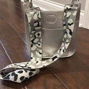 Ahdorned purse with strap